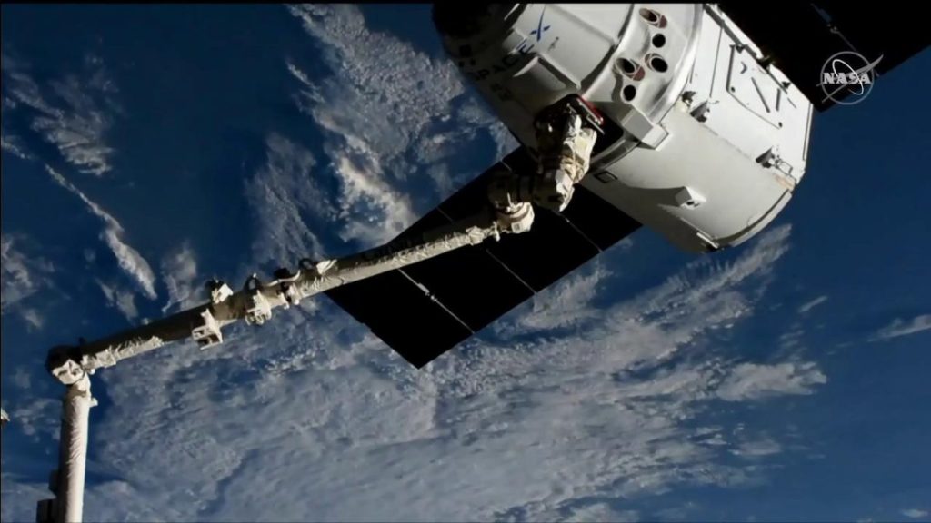 SpaceX Dragon Arrives at Space Station with Space Taxi Docking Mechanism and Science Experiments