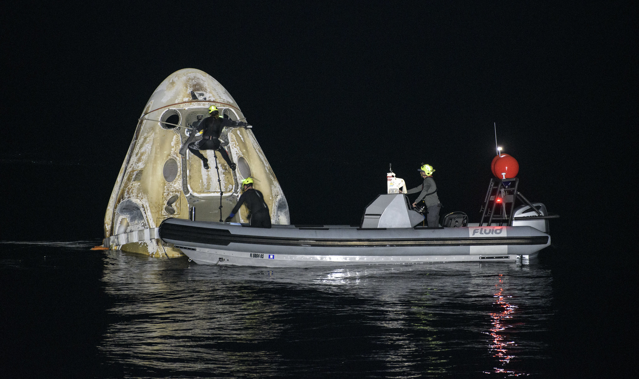 NASA Crew-1 Dragon Astronauts Depart ISS for Safe Splashdown Making 1st US Nighttime Landing Since Apollo 8