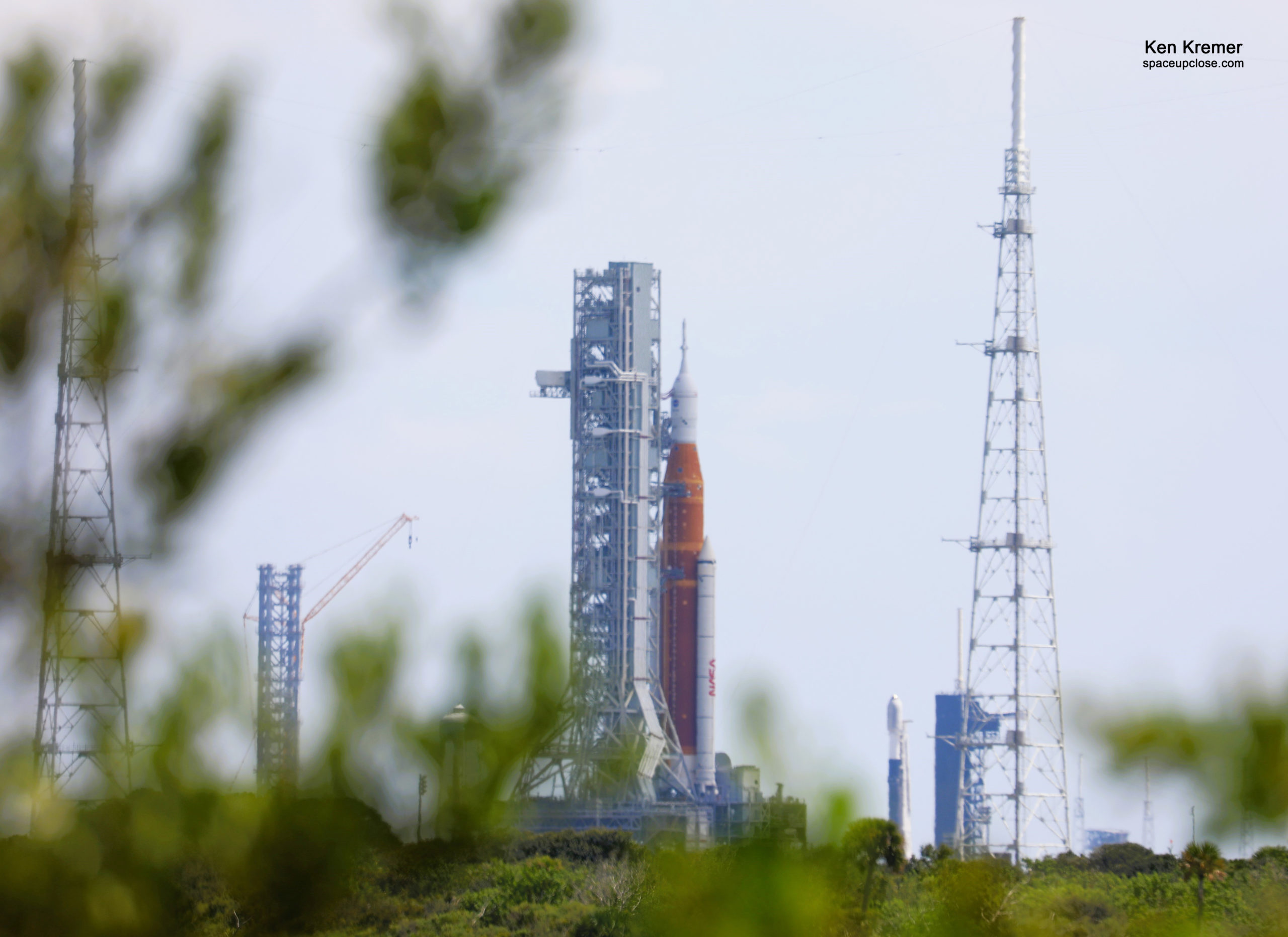 NASA Artemis 1 Moon Rocket and Record Setting SpaceX Falcon 9 Rocket Duo Simultaneously Vertical at KSC Launch Complex 39 after SLS Scrub: Photos